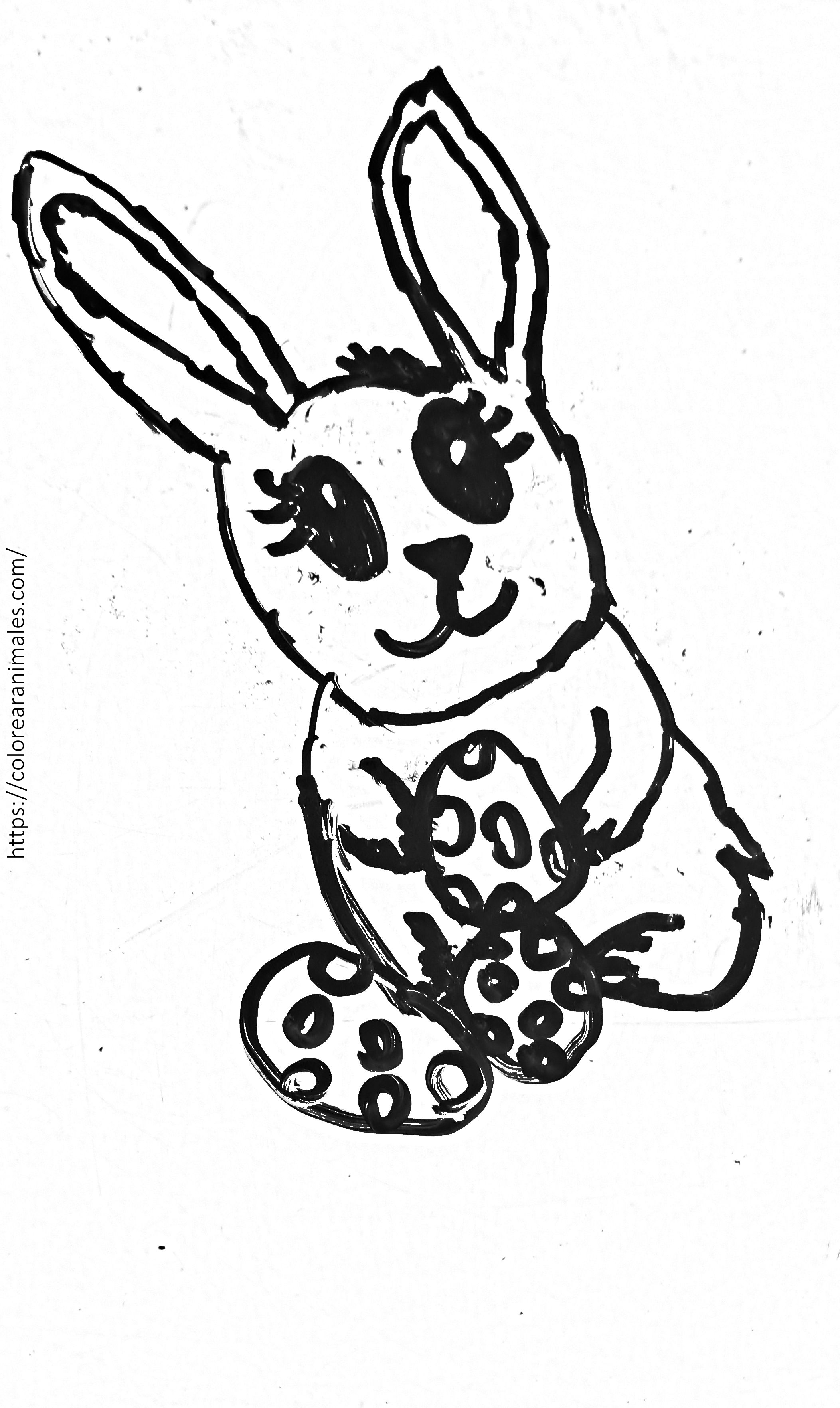 Dibujo para colorear de un conejo de Pascua sujetando un huevo decorado