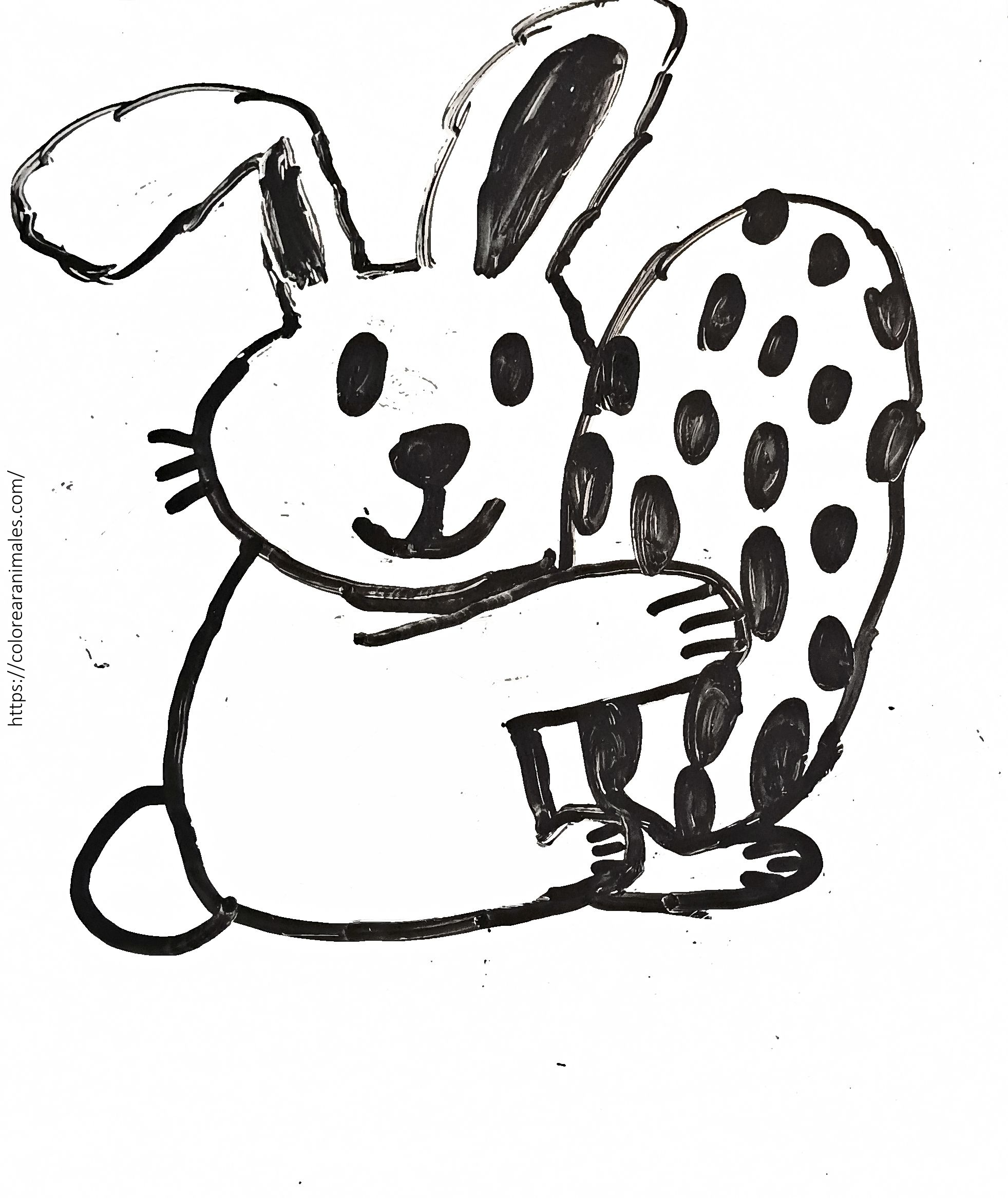 Dibujo para colorear de un conejo de Pascua abrazando un huevo grande de lunares